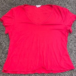 Red t shirt with v neck and slightly ruffled edges